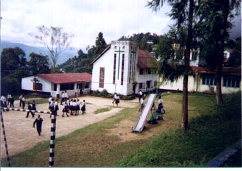 SDA Church with students on playground