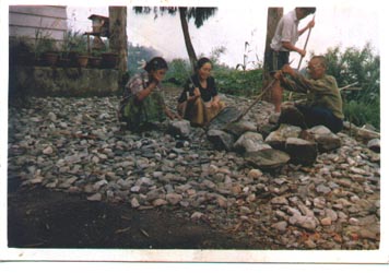 Rock-breaking labor by workers at the school in Kalimpong India, near Darjeeling
